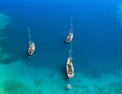 Yachts in the bay near the green island. Summer vacation, Greece, Kefalonia.
